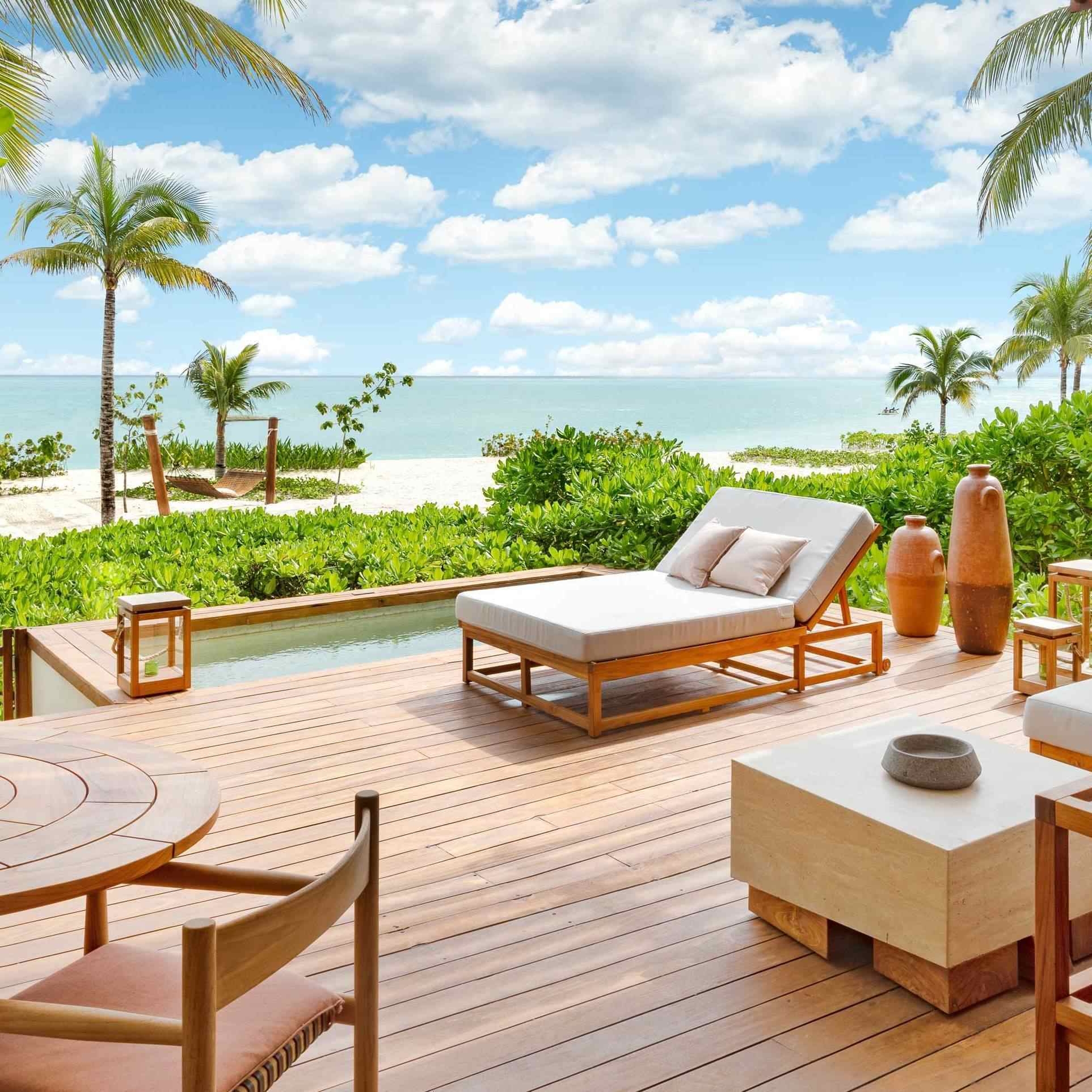 The outdoor area of Rosewood Mayakoba's beachfront suites, directly on a white sand beach.