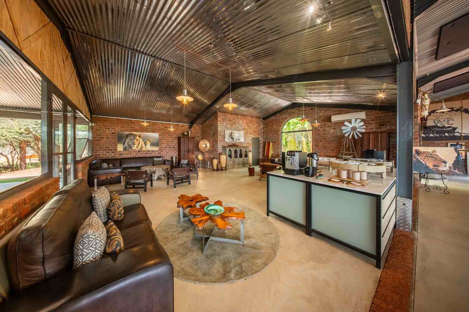 Social seating areas inside The Barn at Okonjima Plains Camp
