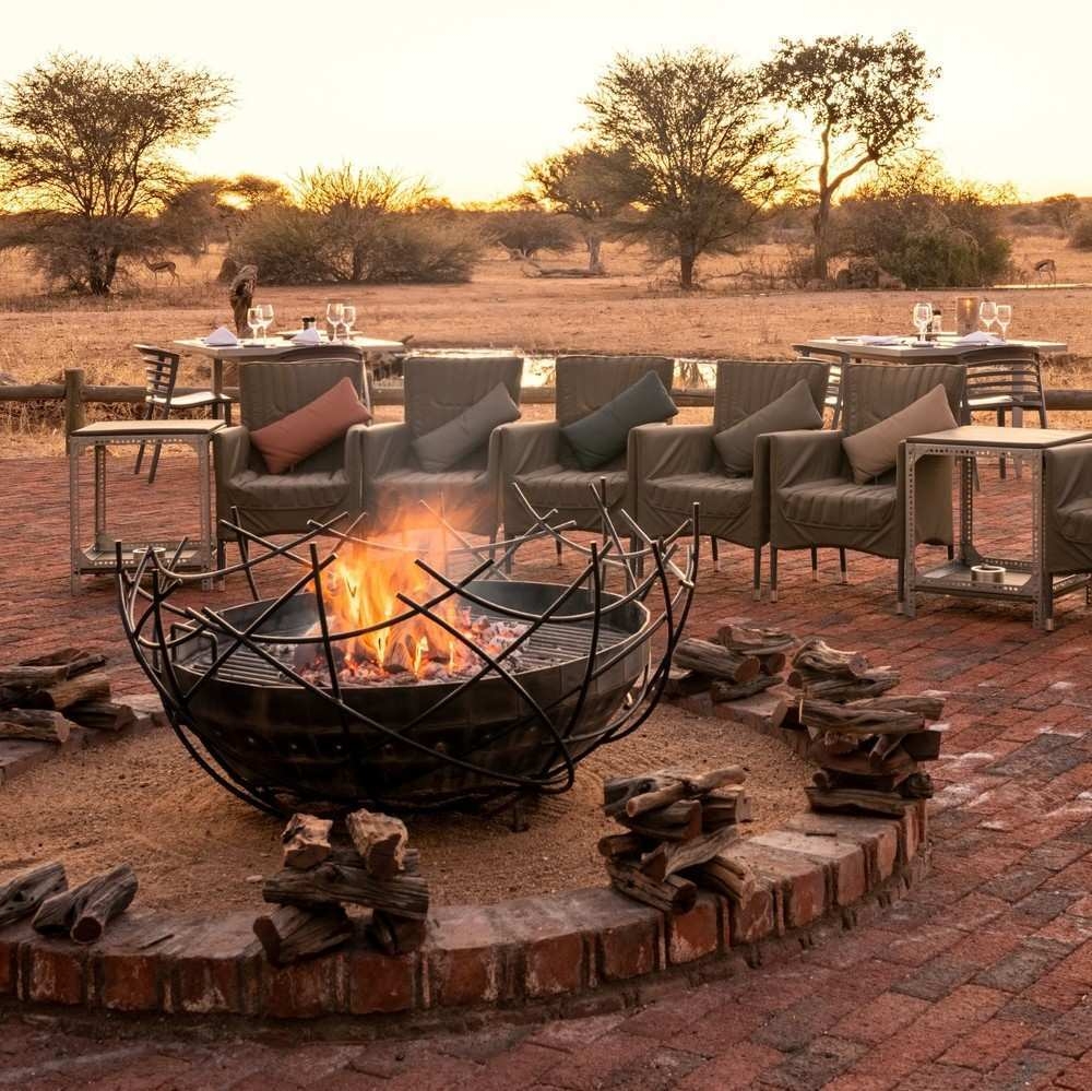 Firepit with camp chair circle at Okonjima Plains Camp