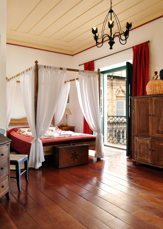 A guest room with four poster bed at Villa Bahia, Salvador