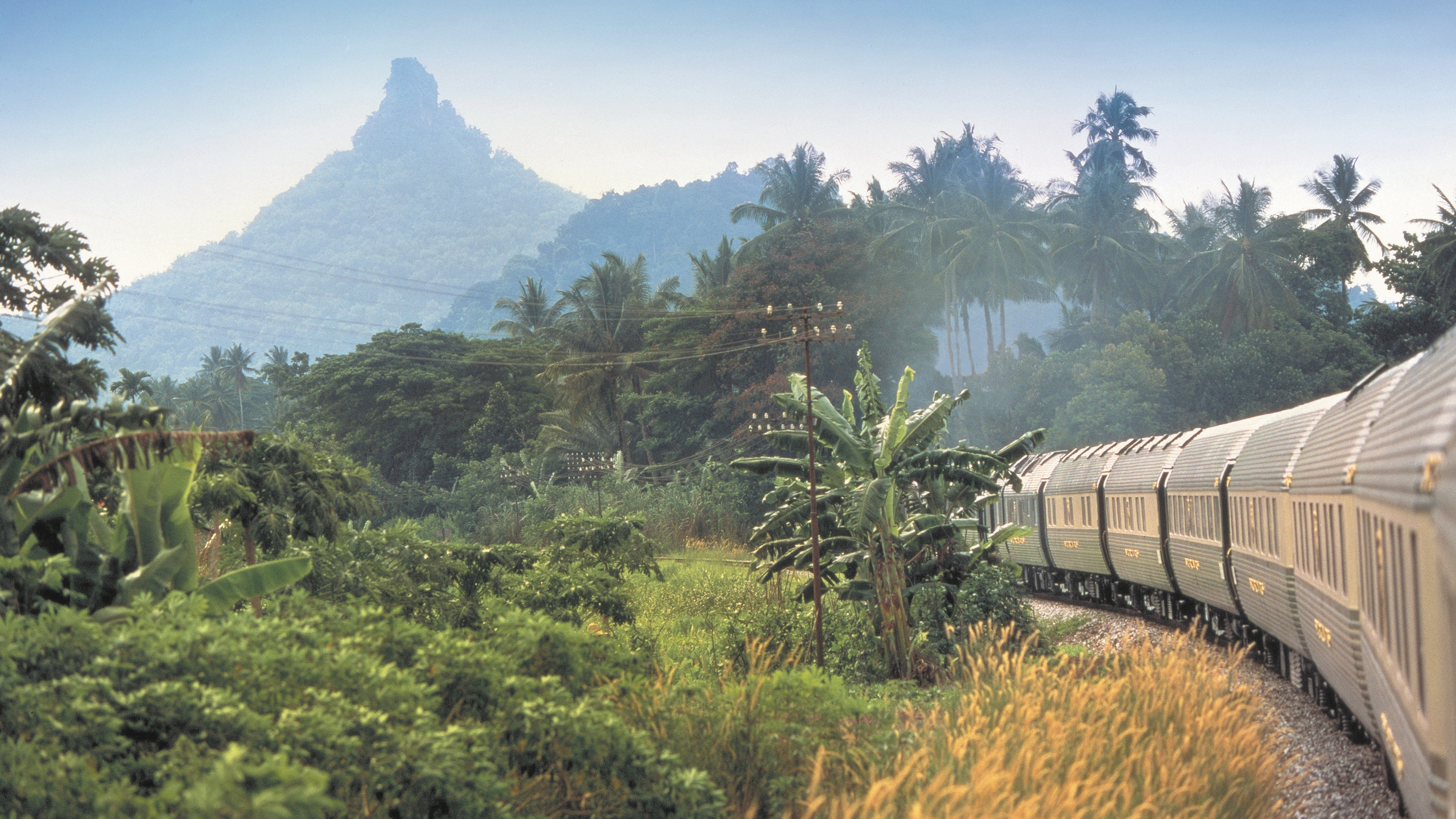 The Belmond Eastern and Oriental Express travelling through the jungle