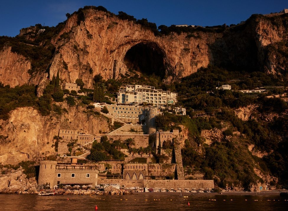 View of Borgo Santandrea embedded in rock cliff face on the coast of Itally