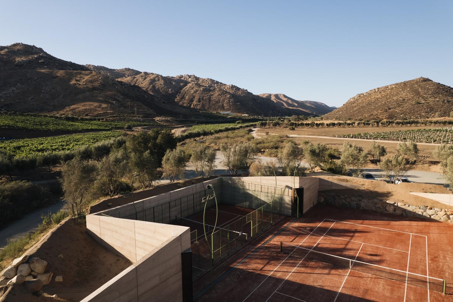 Aerial view of the outdoor tennis court at Casa Ocho, Valle de Guadalupe