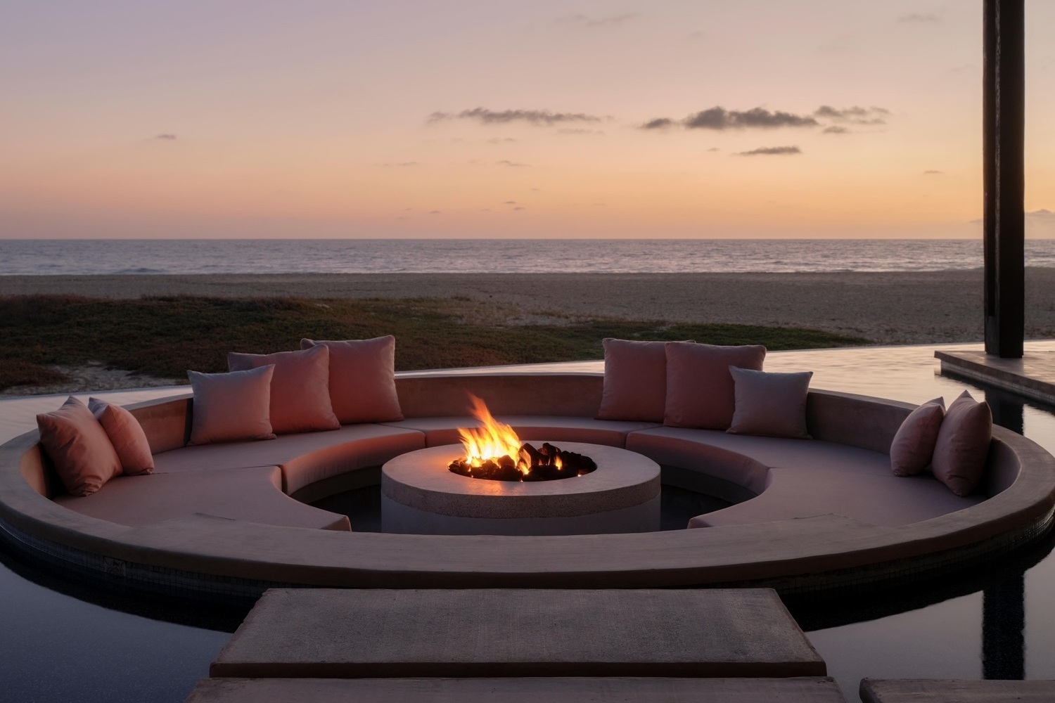 A fire pit by the beach at sunset at Kimpton Mas Olas, Baja California