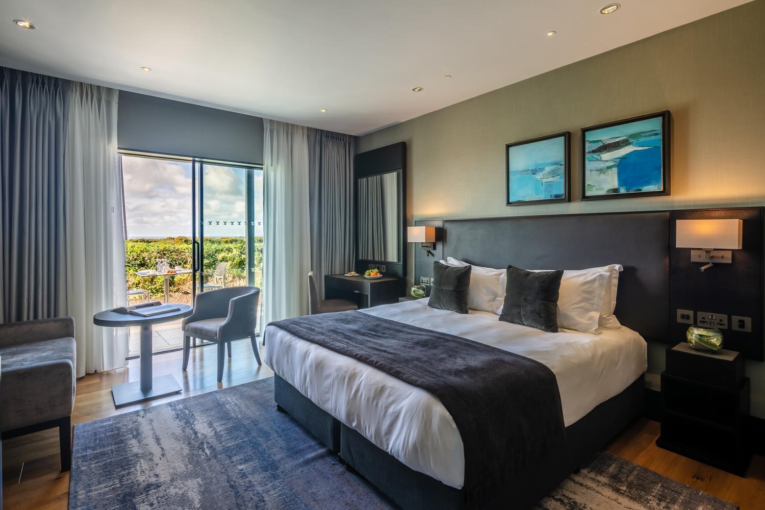 A bedroom with terrace area at Twr y Felin hotel