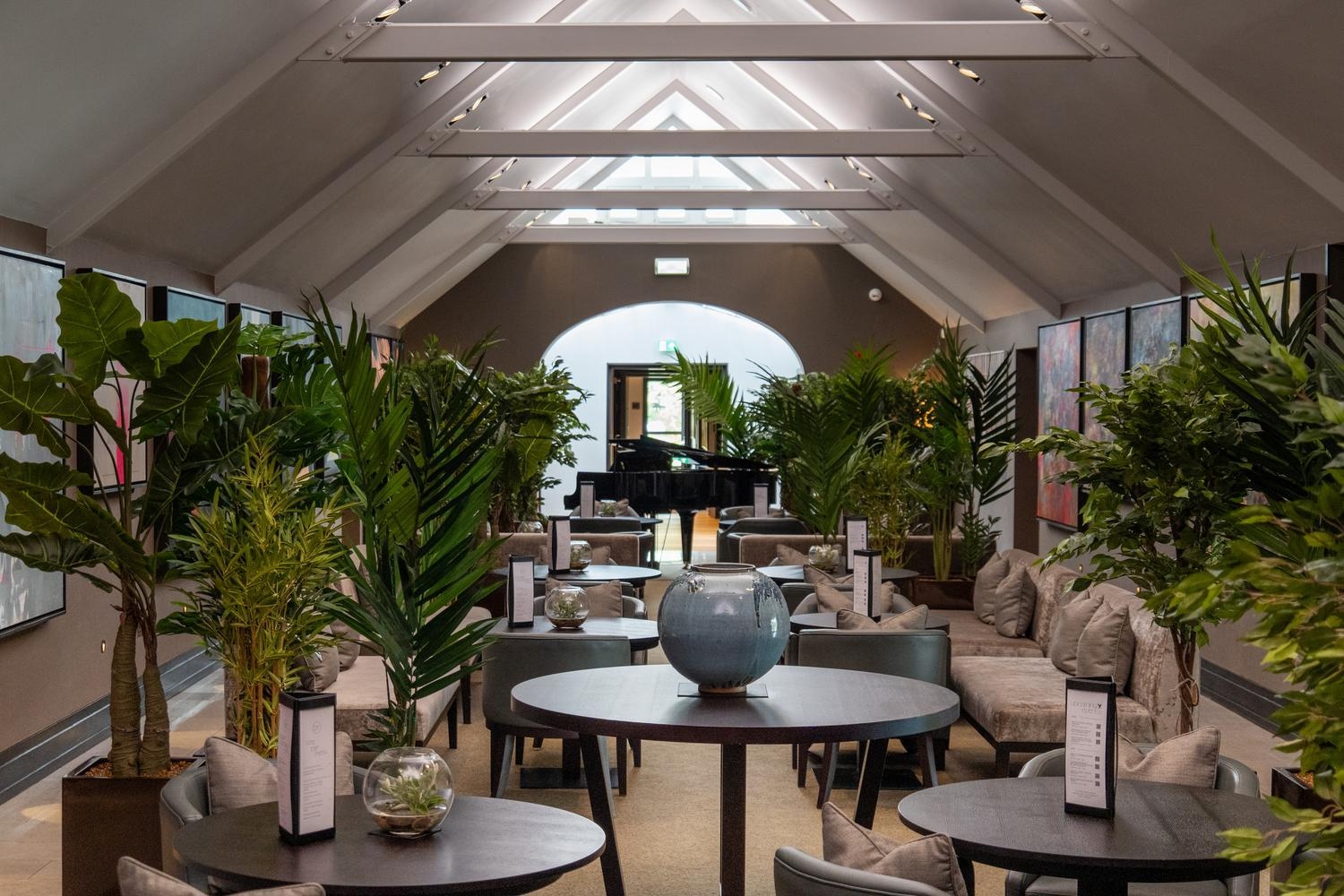 Tables and chairs in the Oriel room at Twr y Felin hotel