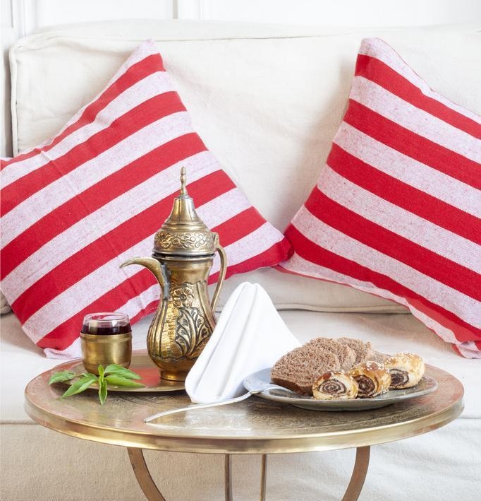 A platter of sweet treats paired with traditional Egyptian tea.