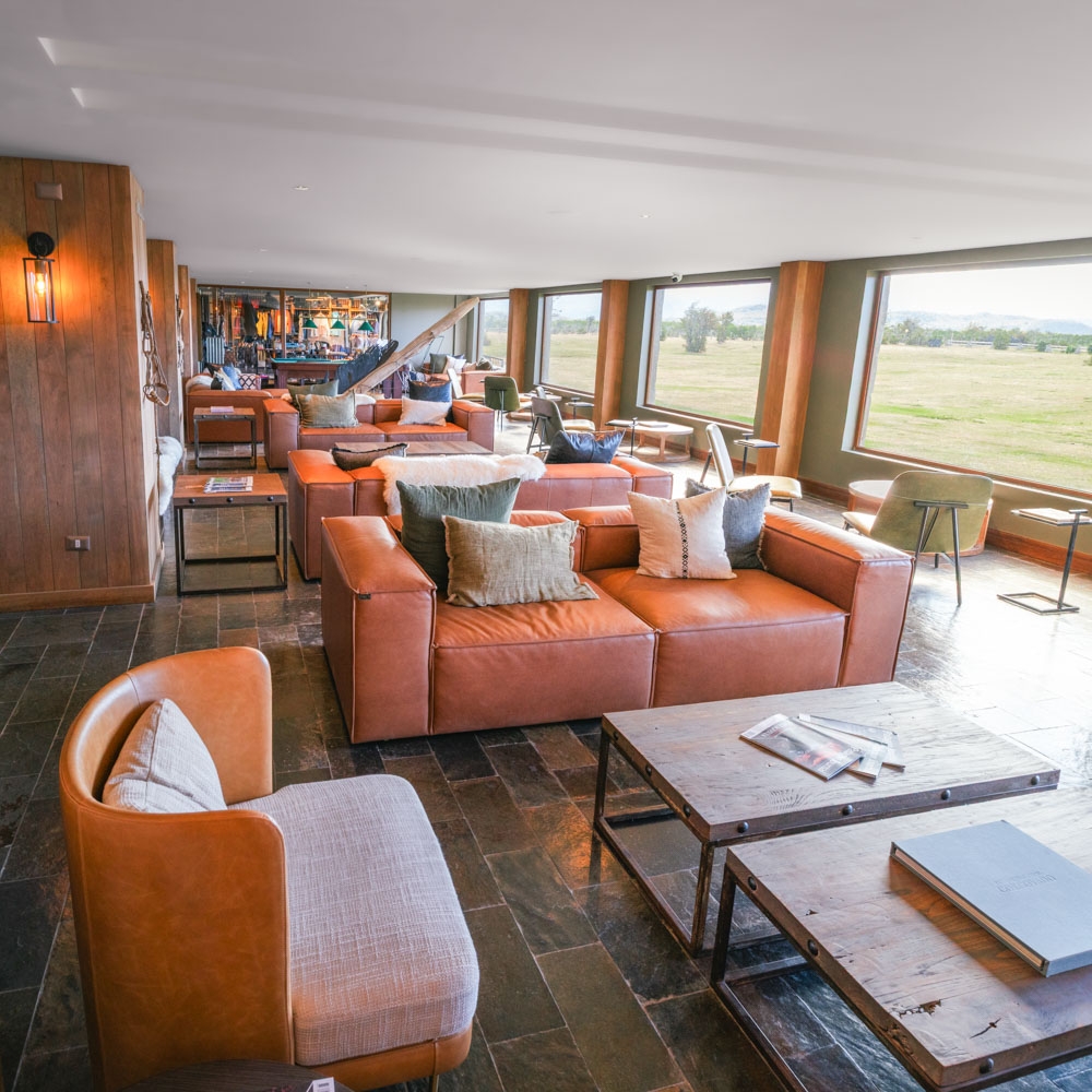 Wide shot of the lounge and shared area of Rio Serrano lodge in Chile.