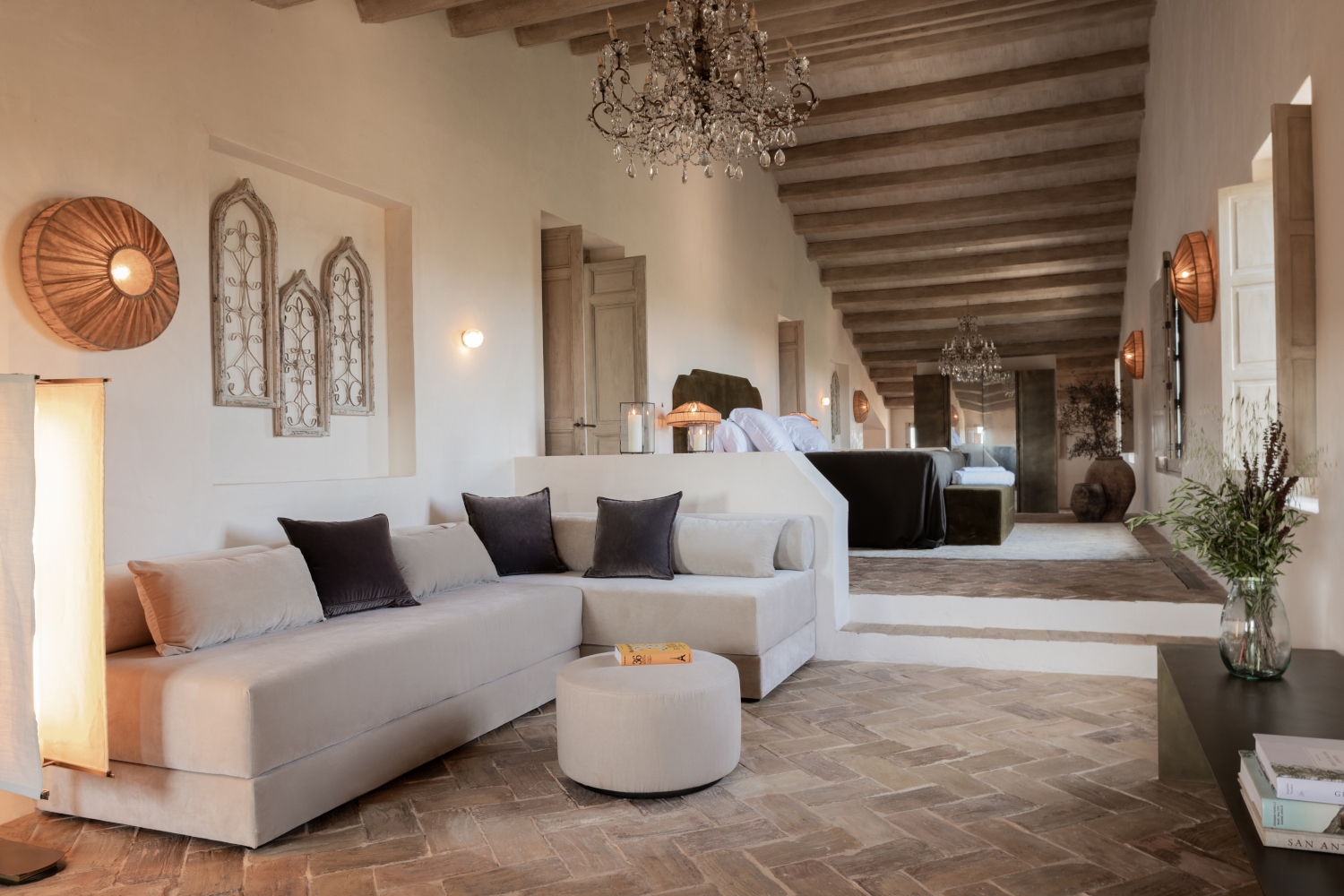 Modern living area in a historic suite at Son Vell in Balearic Islands Spain with vaulted beams and neutral furniture.
