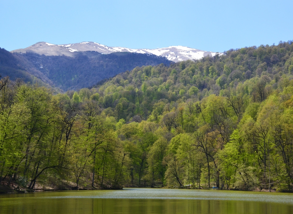 A lake with forest and mountains in Dilijan National Park, Armenia