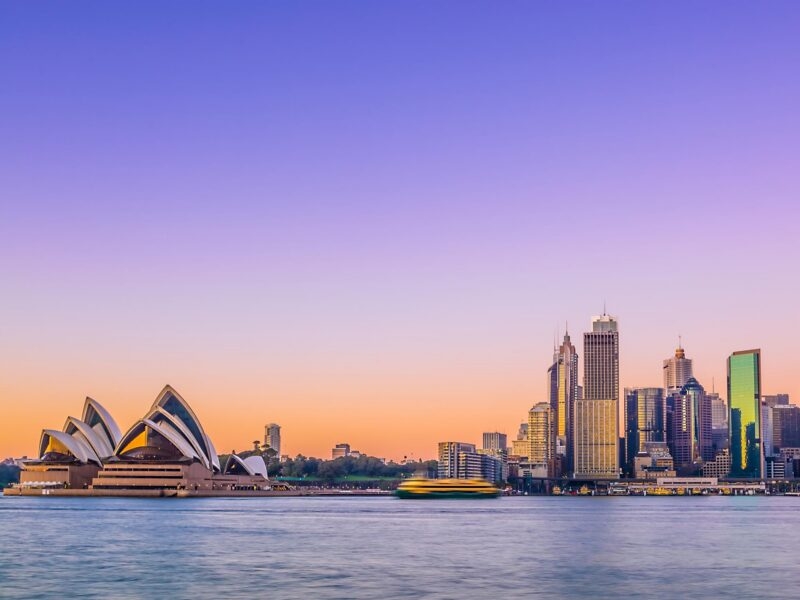 The Sydney Opera House and city skyline at twilight, a staple of luxury Australasia trips.