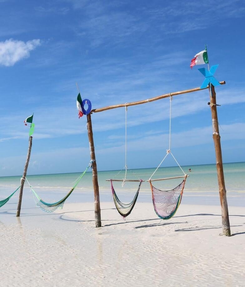 Hammocks strung above the shallow waters of Isla Holbox