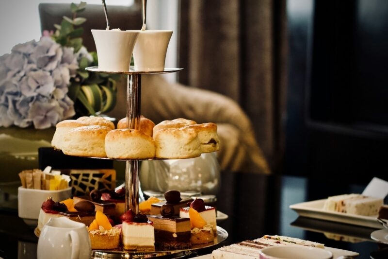 A traditional afternoon tea in UK with a variety of teas and pastries