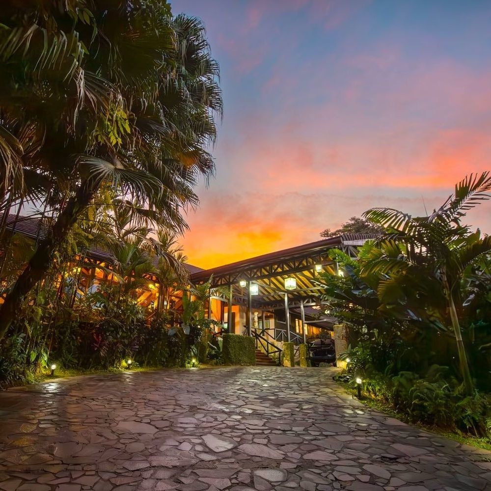 The main entrance to Hotel Rio Celeste at sunset