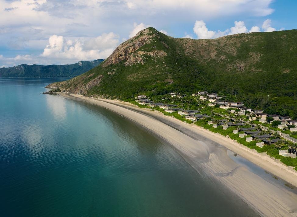 Aerial view of Six Senses Con Dao, with the ocean in the foreground