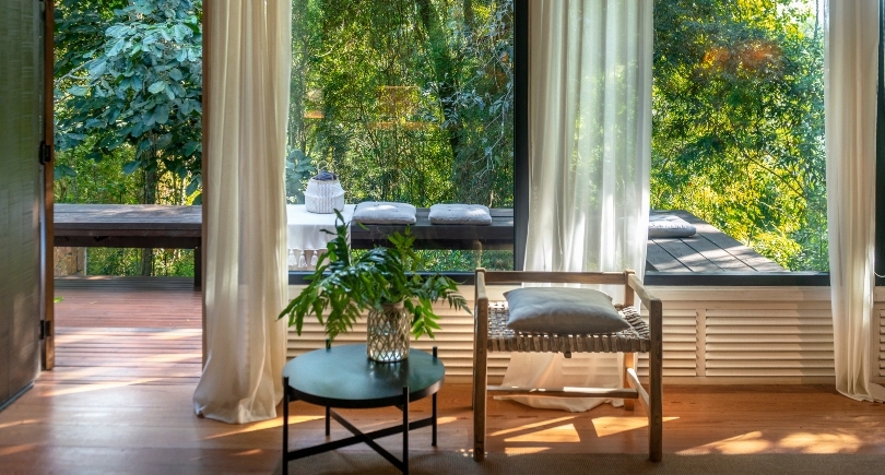 The interior of a villa at Awasi Iguazu overlooking the surrounding forest.