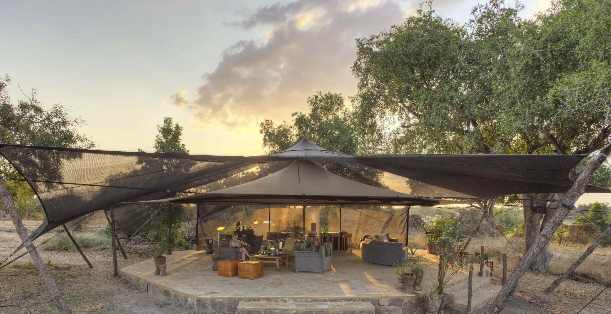 Roho ya Selous's lounge and bar area beneath a canvas tent.