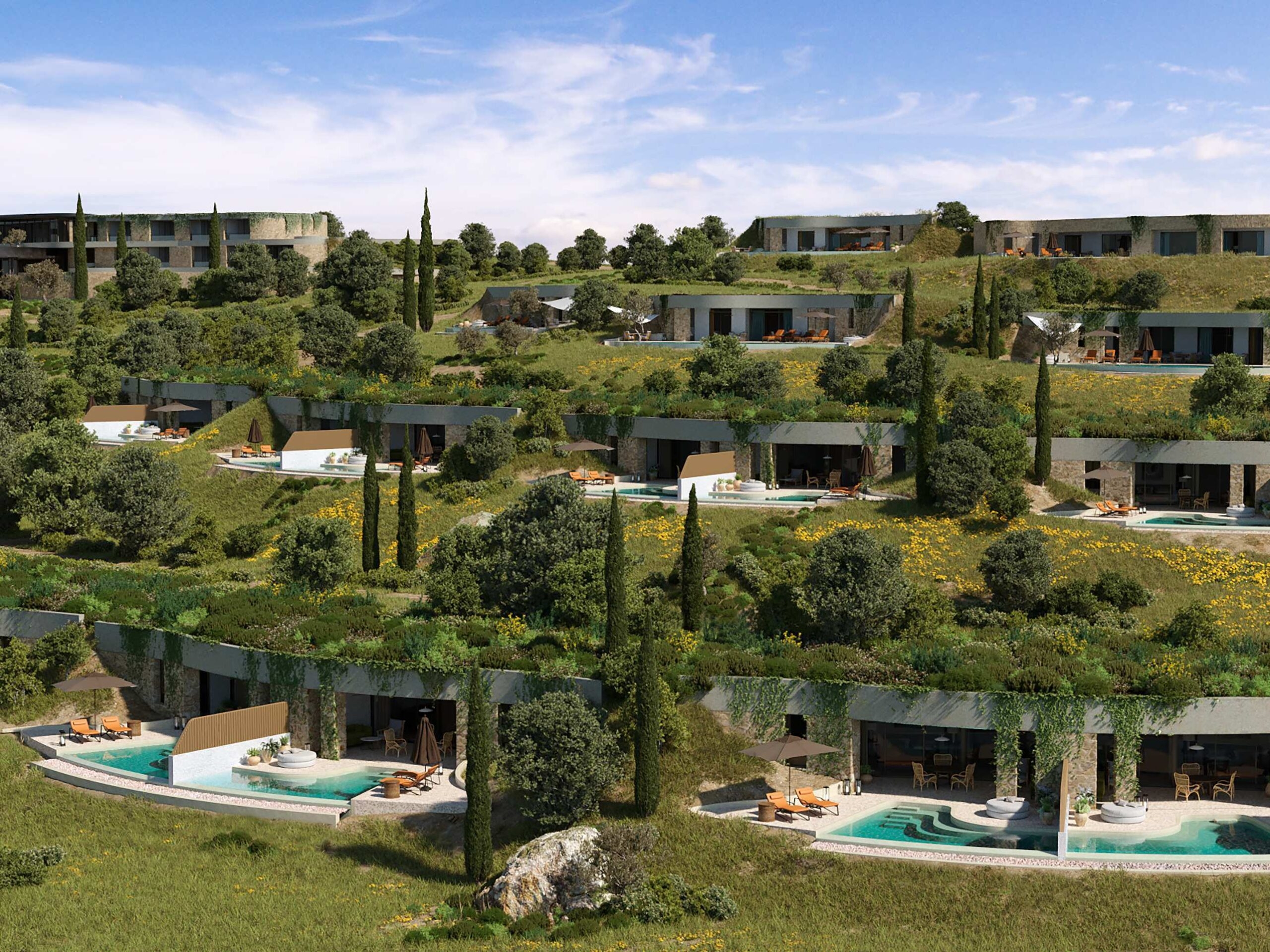 A view of Mandarin Oriental Costa Navarino's villas emerging from a leafy hillside.