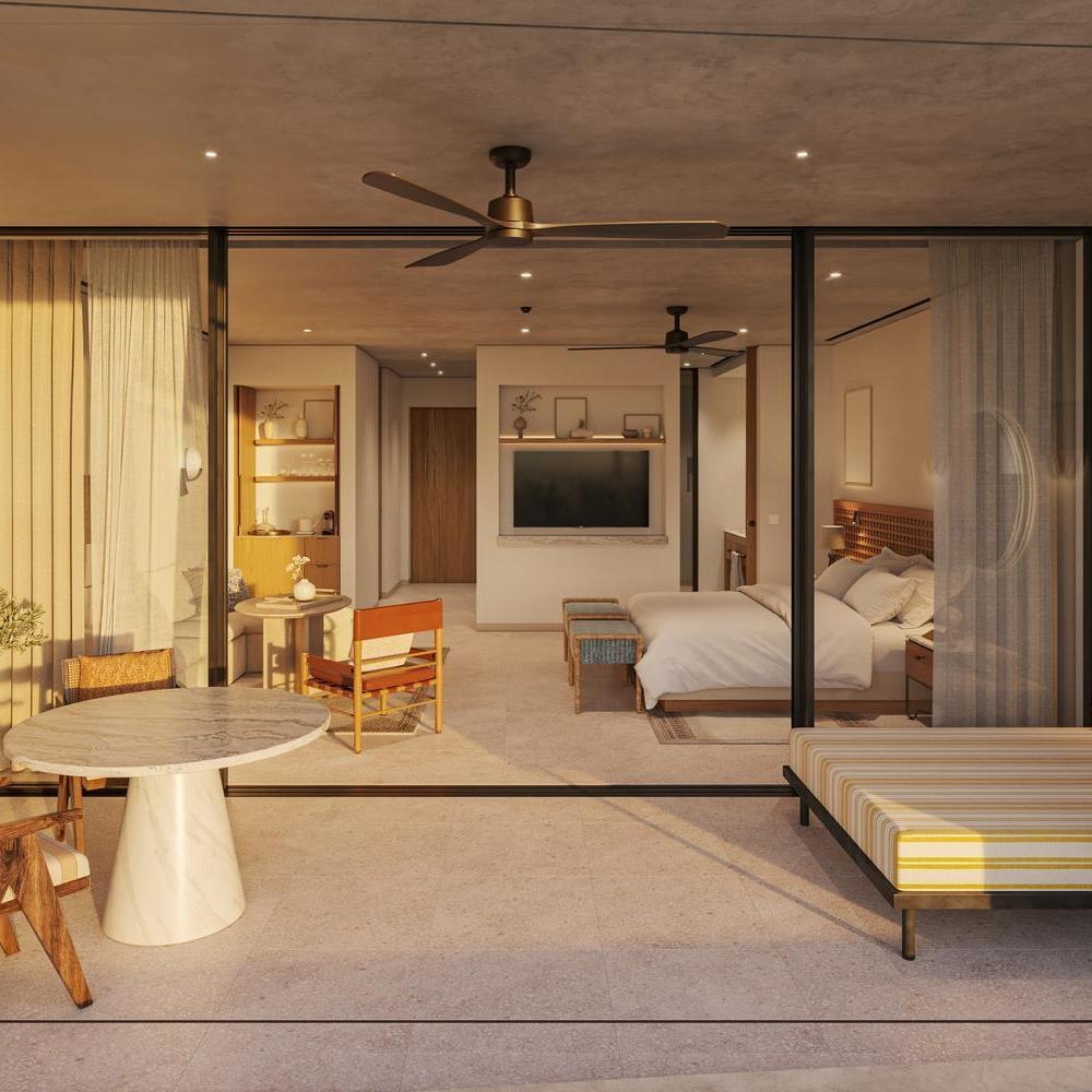 One of Mandarin Oriental Costa Navarino's bedrooms. It features a neutral, elegant palette.
