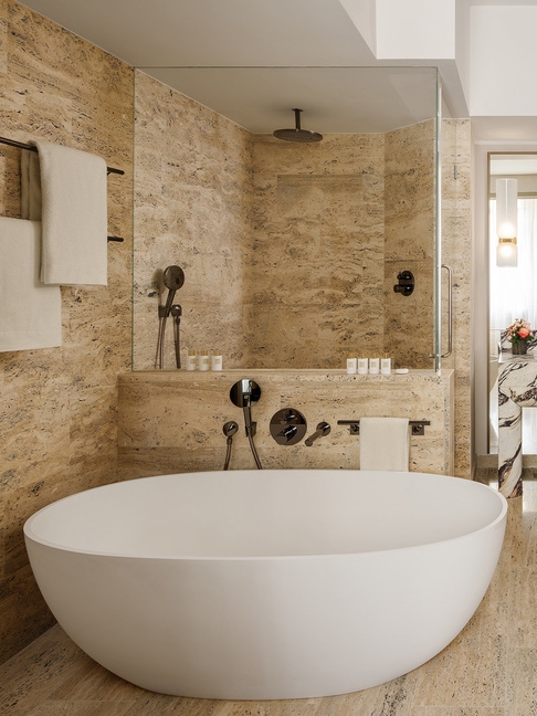 A freestanding bathtub in an ensuite bathroom at Park Hyatt Milan.