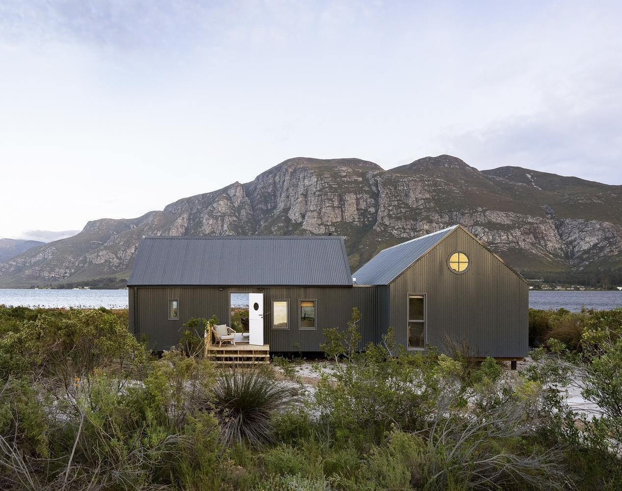 A private boathouse at Coot Club with the Maanschynkop mountains in the background.