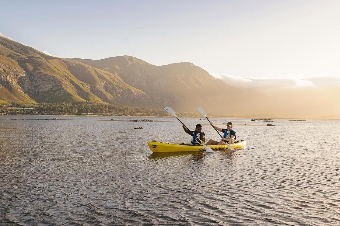 Two people kayaking on the Klein River Lagoon.