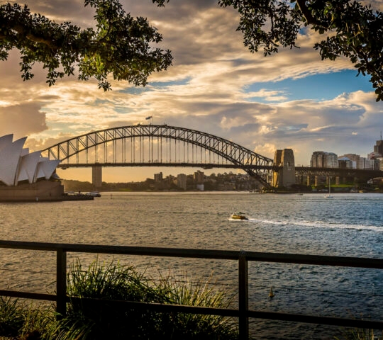 View of the iconic Sydney Opera House and Harbour Bridge from Mrs Macquarie's Chair, Sydney, Australia.