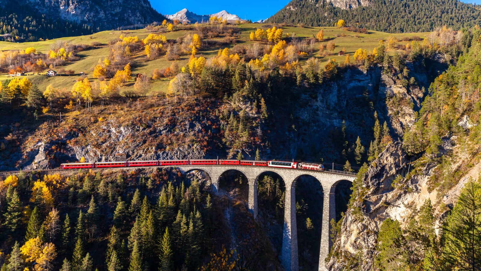 landvasser-viaduct-switzerland A train passes over the Landwasser Viaduct.