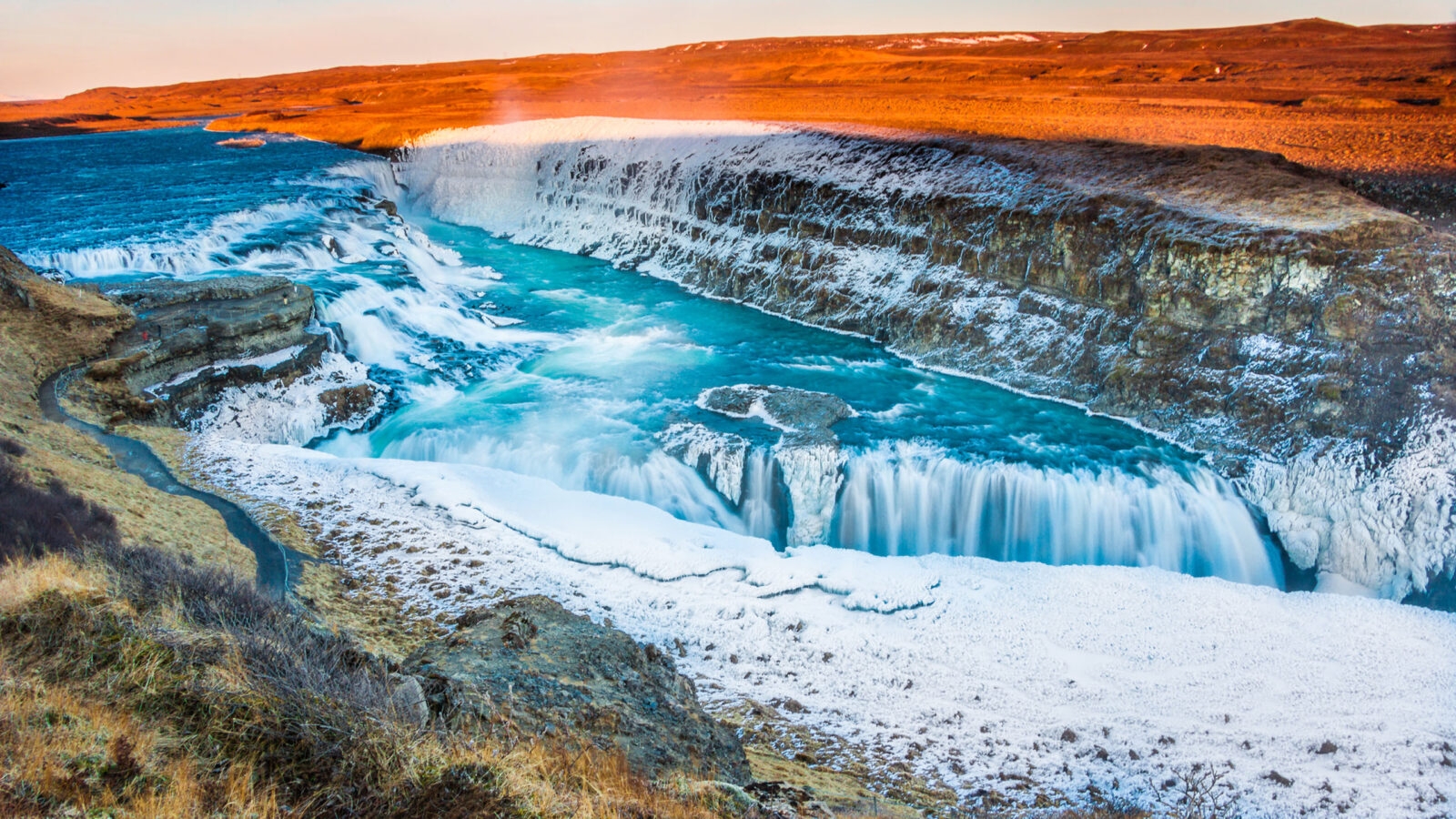 Amazing Icelandic winter landscape of majestic waterfall of frozen Gullfoss