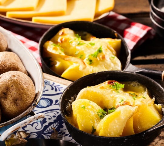 Melted raclette cheese on boiled potatoes.