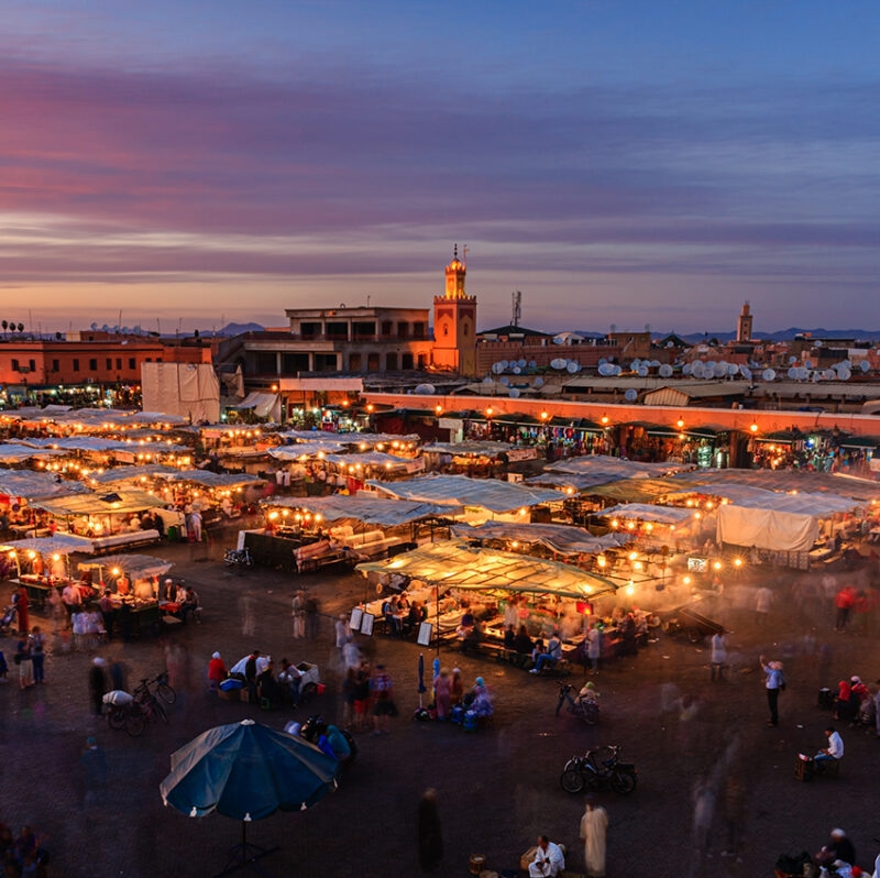 Marrakech outdoor souk with tented stalls at sunset on a luxury Morocco tour