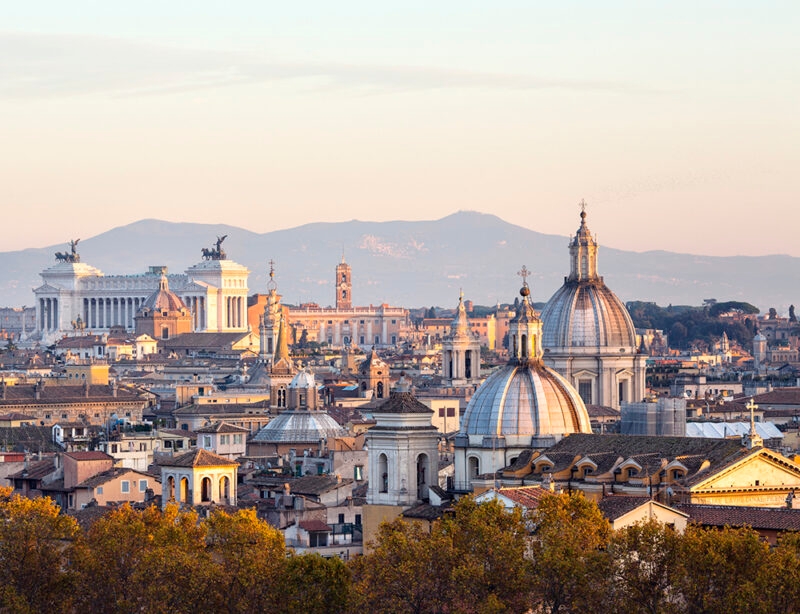 Panoramic view of the Rome skyline with historic domes during luxury Italy family vacations.
