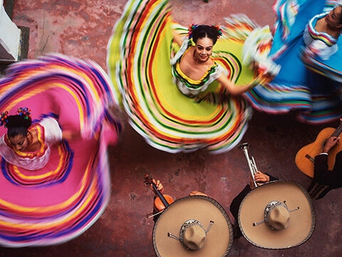 Overhead view of dancers in colorful skirts during luxury special occasion holidays.