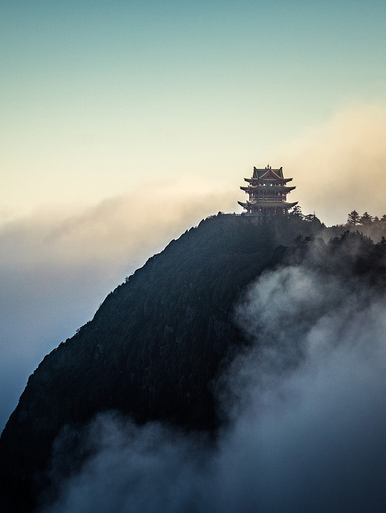 Arts, Culture & History trips - Buddhist temple showing through fog and clouds on mountain top, Emei Mountain, China