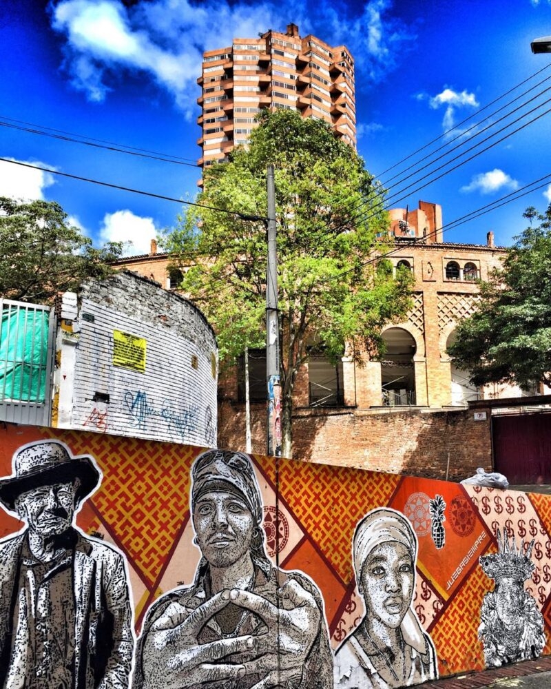 Arts, Culture & History trips - A painted mural in front of a tall building in Colombia