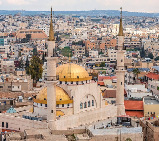 Madaba, Jordan, view of the central and largest mosque with high minarets in the ancient city of the Middle East.