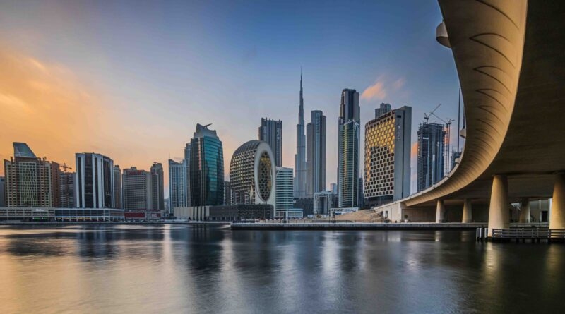 Dubai City skyline from across the water at early sunset