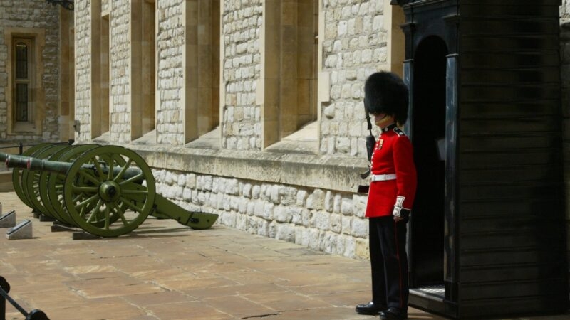 A beefeater stands guard in his traditional attire in London