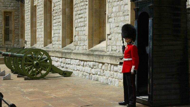 A beefeater stands guard in his traditional attire in London