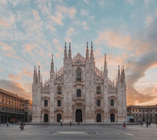 The Milan Cathedral, a stunning example of Gothic architecture, renowned for its intricate facade, towering spires, and breathtaking panoramic views from its rooftop.