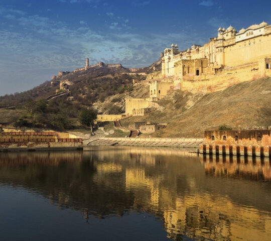 Amber Fort in India shot from the water. The sky can be seen in the background.