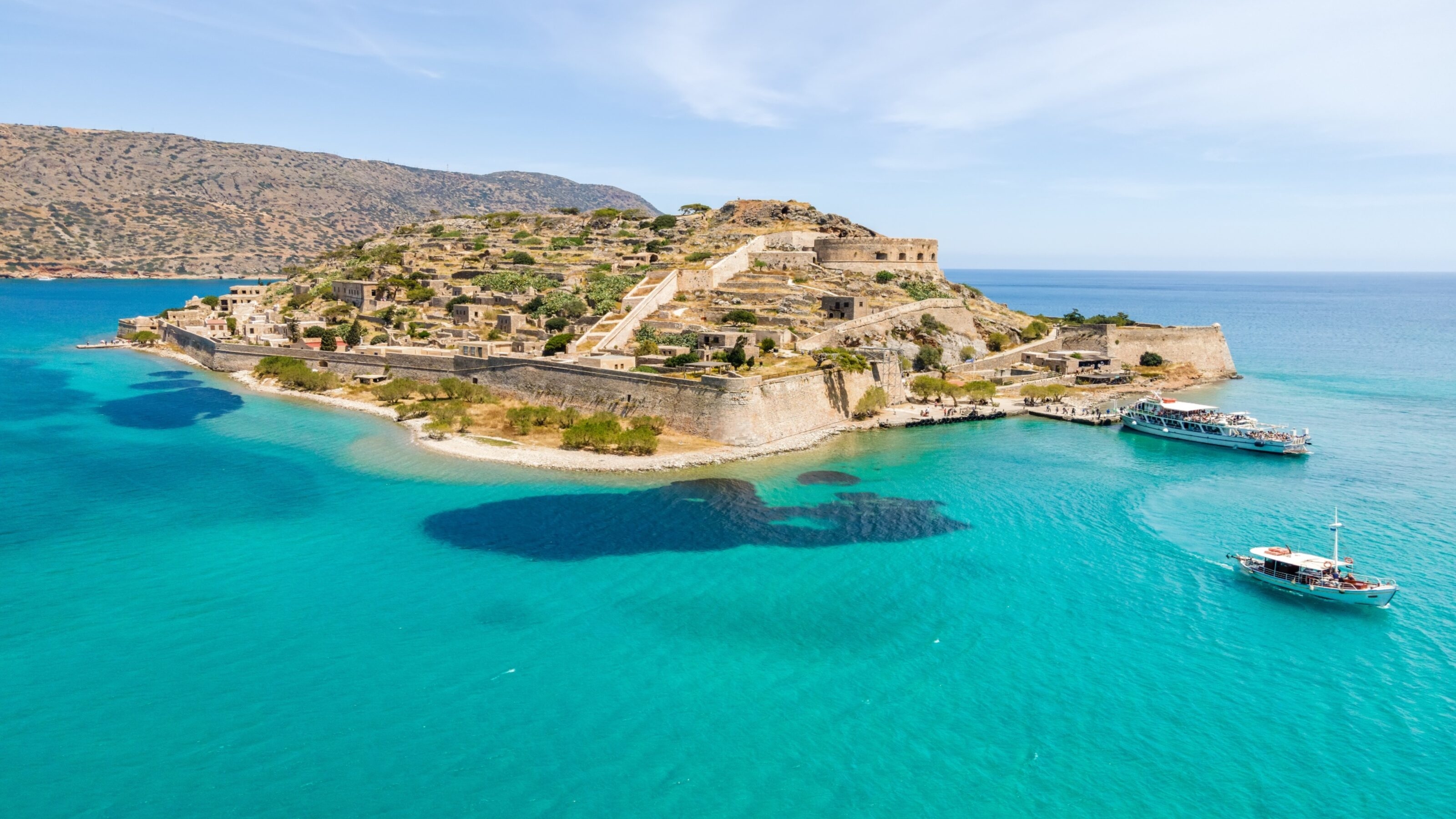 Top view of Spinalonga island with calm sea. Here were lepers humans with the Hansen's disease, gulf of Elounda, Crete, Greece.