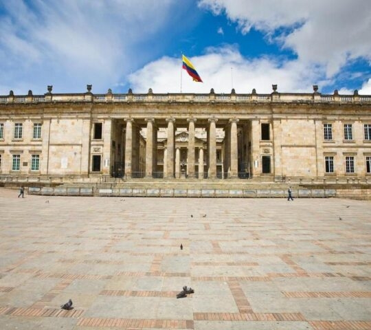 Grand architecture of the Presidential House In Bogota, Colombia with large tiled plaza in front