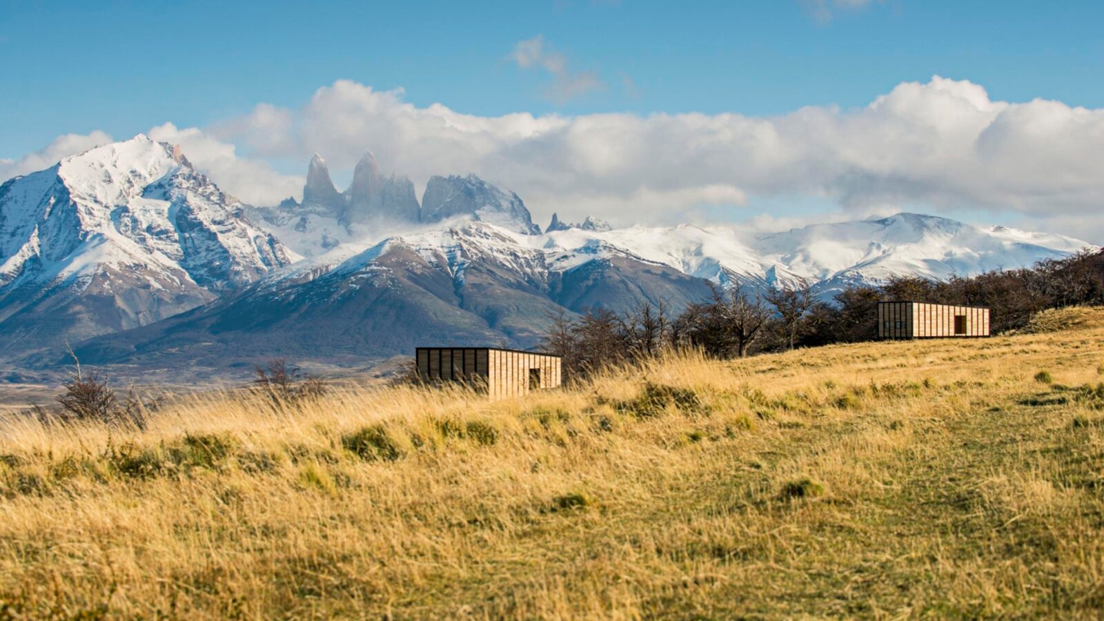 View of private villas with Torres del Paine in the background at Awasi Patagonia