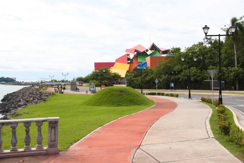 A modern angular colourful museum building by the water