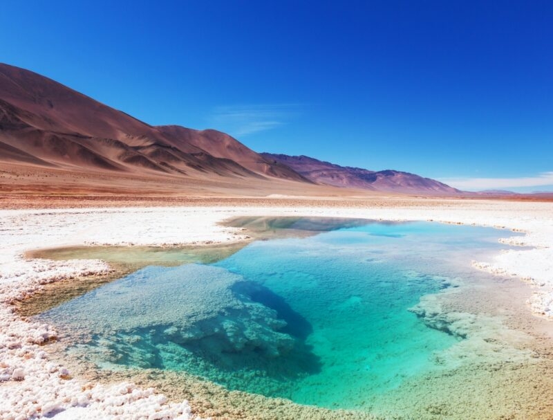 Salt water pool in Salinas Grandes Salt Flat - Jujuy, Argentina. Unusual natural landscapes.