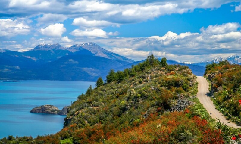 Gravel road called Carretera Austral passing along the shore of a beautiful lake General Carrera in the reomte part of southern Patagonia, Chile