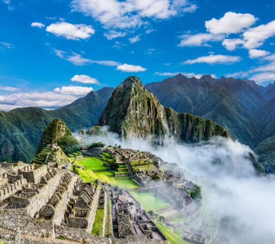 Overview of Machu Picchu, agriculture terraces and Wayna Picchu peak in the background