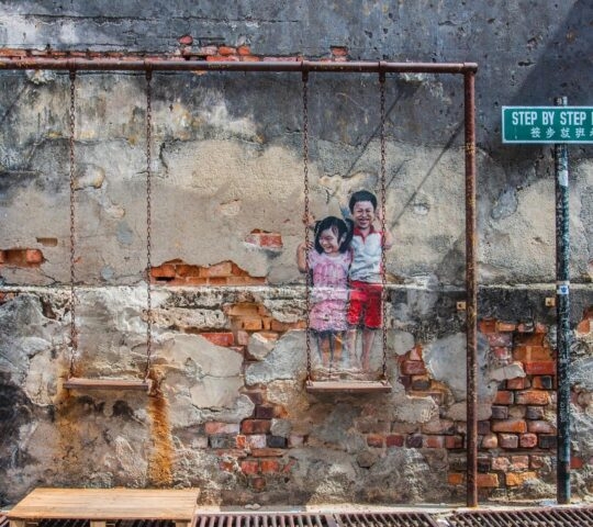 A street art painting of two children in George Town, Penang