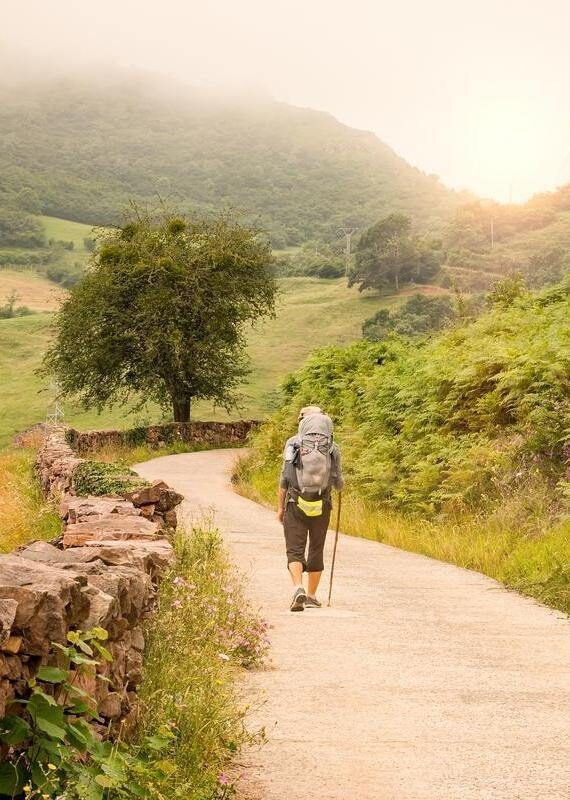 hiker with backpack walking the Camino de Santiago in Spain, Way of St James